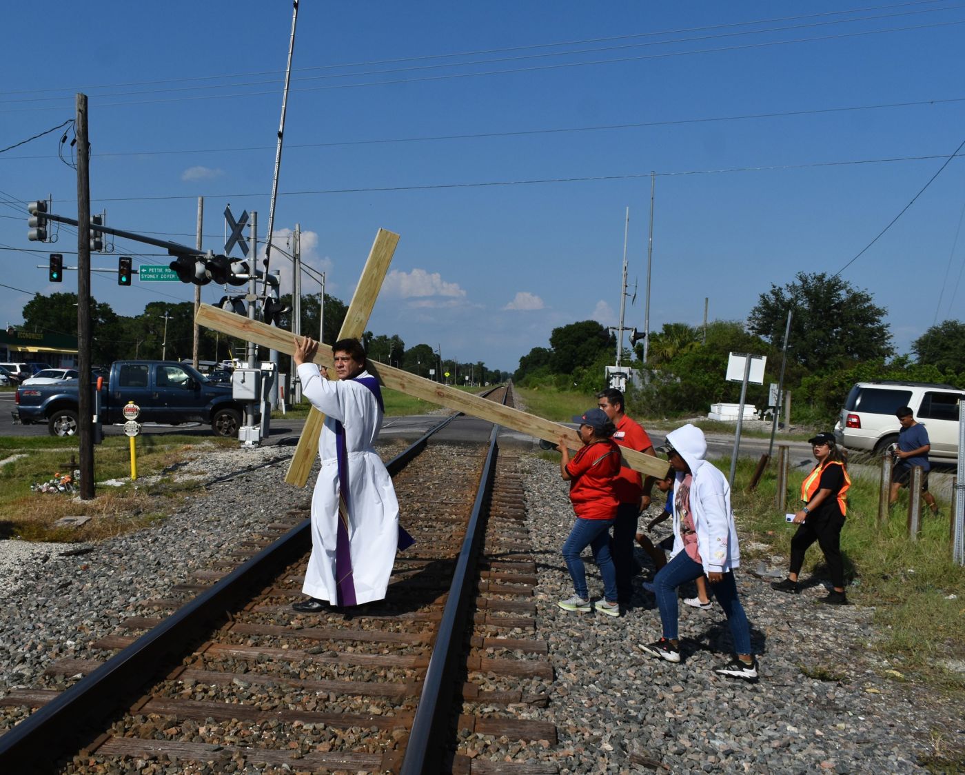 Way of the Cross with the cross carried over the railroad tracks